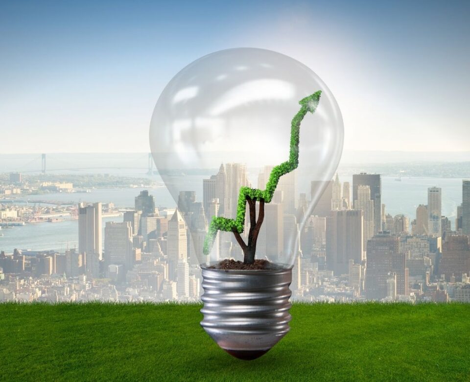 Green Energy Concept with Green Line Graph in Light Bulb