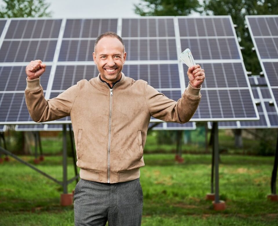 Man is happy about investing in renewable energy.